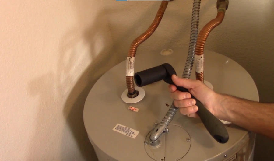 Inspecting water heater connections during a Torrance repair visit