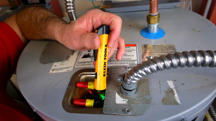Electrical connections on a water heater during a repair in Torrance